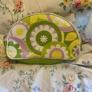 Clinique NWOT cosmetic bag. Green, yellow, purple and white. White inside